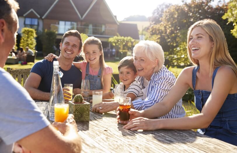 woman smiling with her family after visiting Bonnie View Dental in Dallas, TX