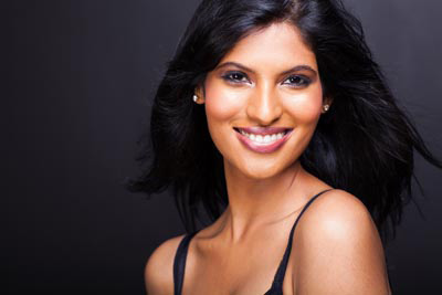 woman smiling after getting her teeth whitened at Bonnie View Dental in Dallas, TX